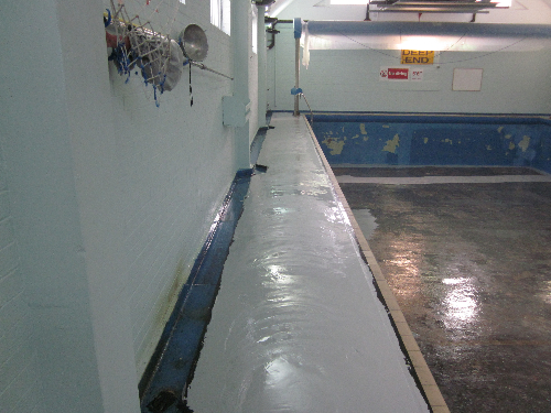 Installation of epoxy regulating layer at swimming pool Installation of epoxy regulating layer at swimming pool